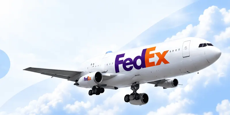 FedEx aircraft above the clouds